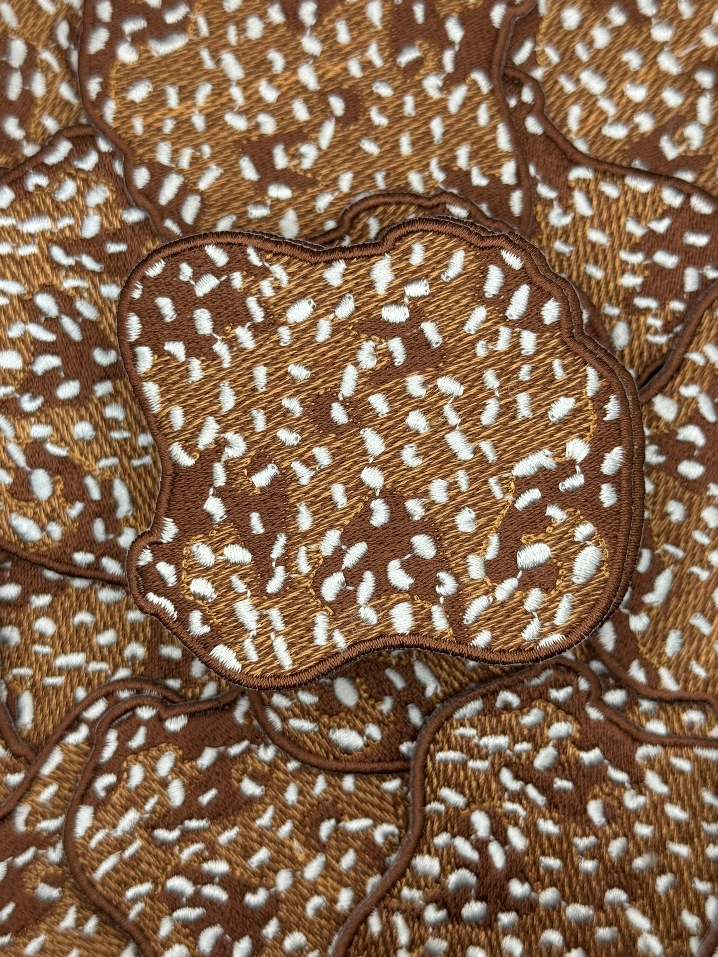 Axis hide embroidery patch
